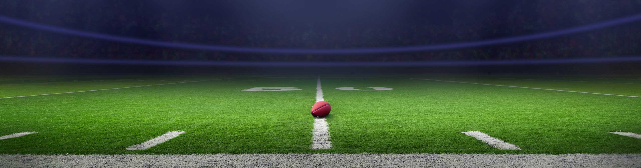 Football field with dark blue background